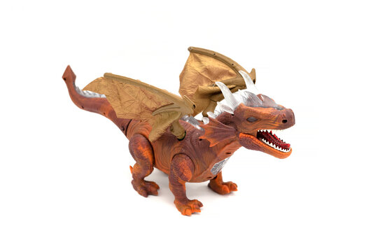 Plastic dragon toy isolated on white background.