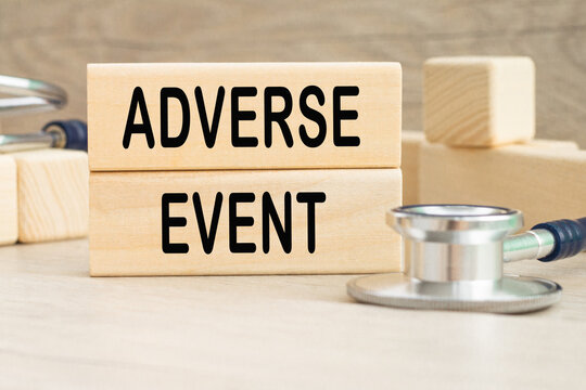 ADVERSE EVENT information written on wooden bars. Medical concept