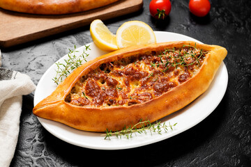Traditional Turkish cuisine. Turkish pizza or Pita with ground beef and cheese.
