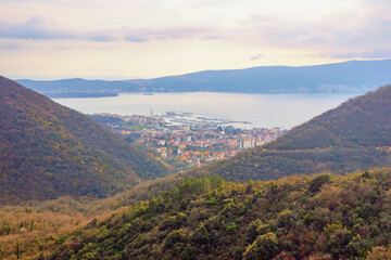 Fototapeta premium Beautiful mountain landscape. Calm Mediterranean evening. Montenegro, view of Kotor Bay and Tivat city from mountainside