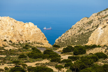 Rocky coast Landscape with ship on sea, Spain