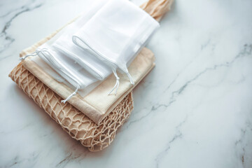 Cotton bags. Zero waste concept. Eco friendly. Flat lay. Textile shopping bag on a white background. Eco cotton bag copy space. Reusable shopping bags.