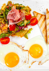 scrambled eggs two toasts and salad