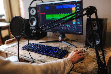 Workplace of musician at home. Table with pc and microphone
