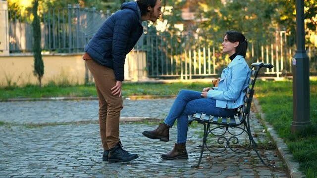 dishonesty, deception - man distracts a girl and his accomplice steals her purse