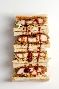 Katsu Sandos Japanese Sandwich With Chicken Or Pork Chop, Cabbage And Tonkatsu Sauce Isolated On White.