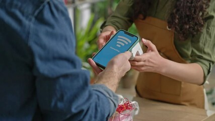 In the store, the buyer pays using a contactless terminal using NFC technology and receives a payment receipt from the seller . - Powered by Adobe