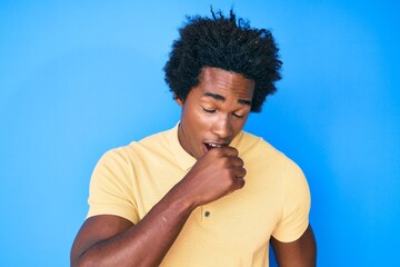 Handsome african american man with afro hair wearing casual clothes feeling unwell and coughing as symptom for cold or bronchitis. health care concept.