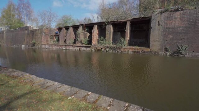 A derelict industrial site on a canal in Birmingham West Midlands UK