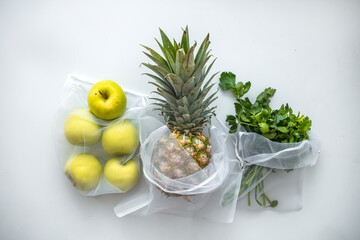 Groceries in eco bags. eco natural bags with fruits and vegetables, eco friendly, flat lay. sustainable lifestyle concept. zero waste food shopping. plastic free items. reuse, reduce, recycle, refuse