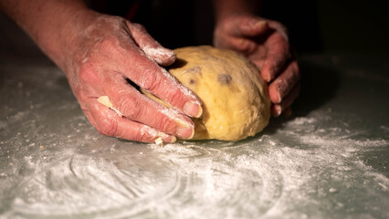 Woman kneading bread by hand