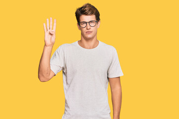 Handsome caucasian man wearing casual clothes and glasses showing and pointing up with fingers number four while smiling confident and happy.