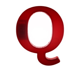 Plastic letter Q on magnet isolated on white background, top view
