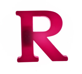 Plastic letter R on magnet isolated on white background, top view