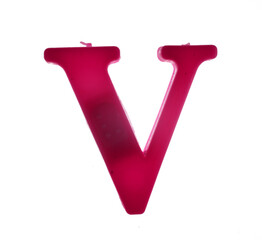 Plastic letter V on magnet isolated on white background, top view