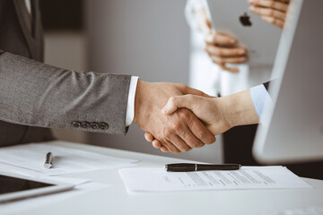 Business people shaking hands finishing contract signing, close-up. Business communication concept. Handshake and marketing