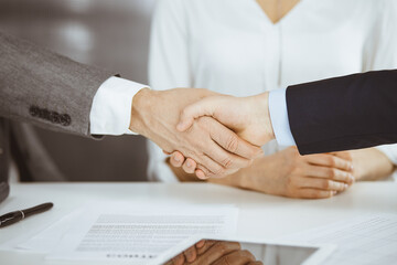 Business people shaking hands finishing contract signing, close-up. Business communication concept. Handshake and marketing