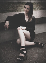 Vintage style faded portrait of a stylish woman with vignette