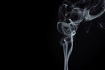 Movement of abstract smoke on a black background. Selective focus. Overlay layer