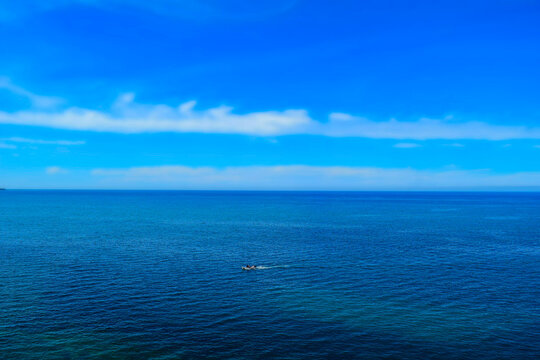 Beautiful view of a wooden boat on open Mediterranean sea 
