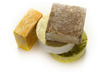 various natural soaps on a white background