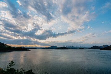 beautiful blue sky lake view high peak jungle mountains green river forest at Kaeng Krachan dam National Park, Phetchaburi, Thailand.