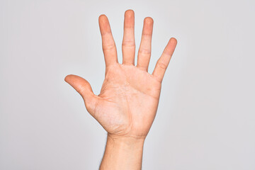Hand of caucasian young man showing fingers over isolated white background counting number 5...