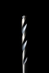 Closeup of high speed steel drill bit with black background