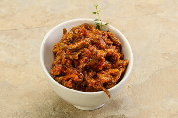 Canned anchovy in tomato sauce