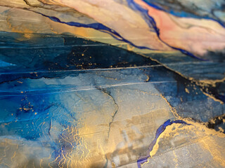 Abstract gold art — blue-pink-yellow background with beautiful smudges and stains made with...