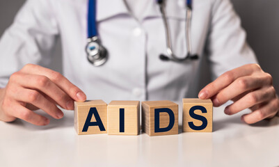 AIDS acronym word inscription in doctor hands