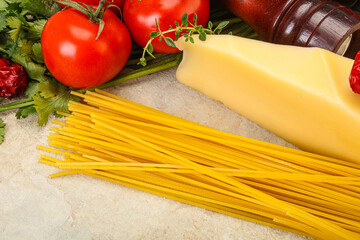 Raw Italian spaghetti heap with cheese
