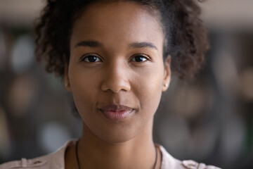 Crop close up portrait of young African American woman look at camera have webcam digital online virtual event. Millennial biracial female talk speak on video call. Diversity, ethnicity concept.
