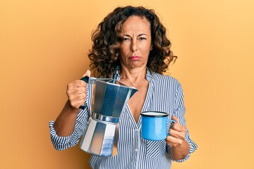 Middle age hispanic woman drinking italian coffee skeptic and nervous, frowning upset because of problem. negative person.