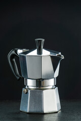 Moka coffeemaker on the dark background.