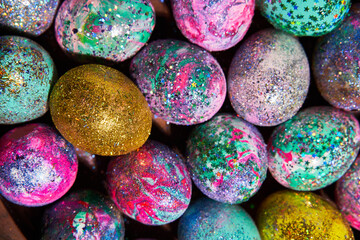 Fototapeta na wymiar Many colorful shiny eggs. Concept of Happy Easter.