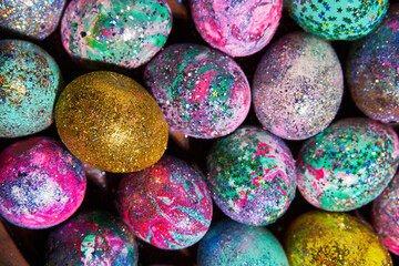 Many colorful shiny eggs. Concept of Happy Easter.