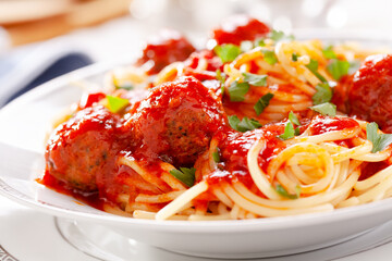 Bowl of homemade pasta with meatballs and tomato sauce
