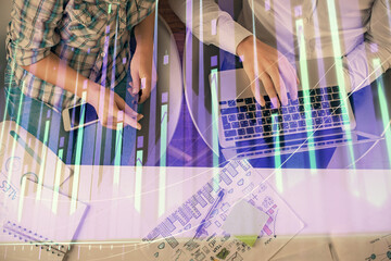 Multi exposure of man and woman working together and forex graph hologram drawing. Financial analysis concept. Computer background. Top View.