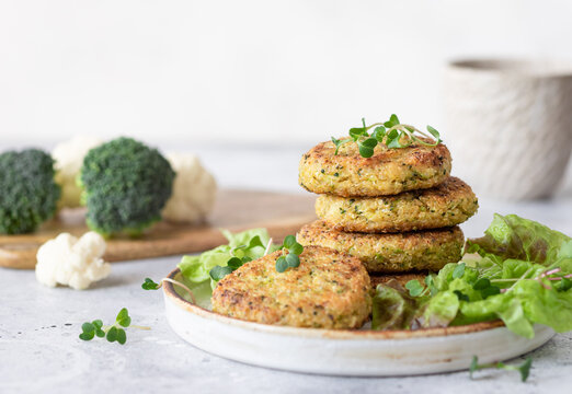 Vegan burgers with quinoa, broccoli, cauliflower served with salad. Healthy vegan food concept. copy space