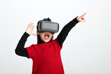 Cute Asian little girl playing with VR glasses