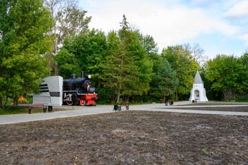 Monument-steam locomotive Su 208-46 and the chapel of St. Nicholas the Wonderworker, Rzhev, Tver region, Russian Federation, September 20, 2020