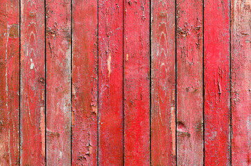 red wood background, weathered wood fence with peeling paint