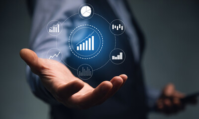 man holding phone with graph icon