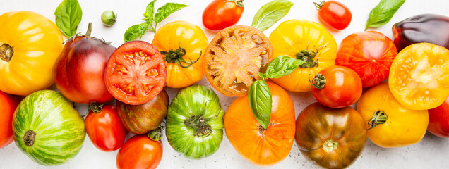 Mixed tomatoes top view. Composition with variety of colorful fresh organic tomatoes.