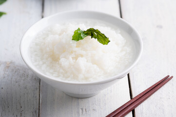 Mush or boiled rice in bowl asian food style