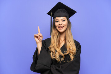 Young university graduate Russian girl isolated on white background pointing up a great idea