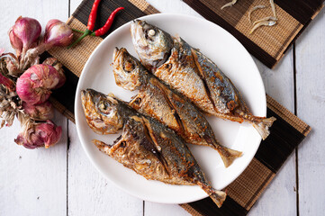 Deep fried mackerel with fish sauce, Traditional Thai food.