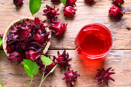 Roselle juice on wooden background, herbal organic tea for good healthy