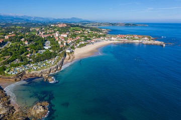 Fototapeta premium Comillas town coast on sunny day aerial view, Cantabria, Spain.